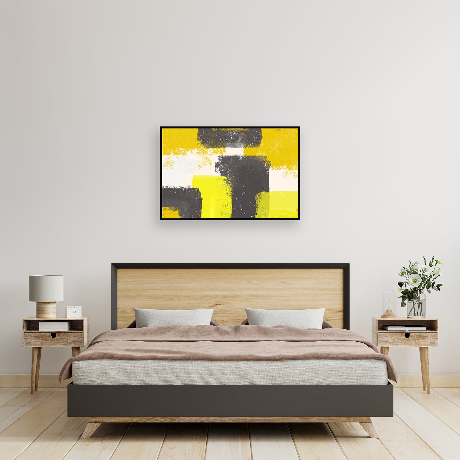 Abstract explosion of yellow, gray, and white on a white wall canvas. 