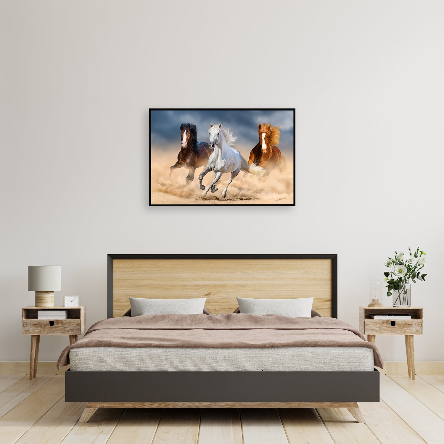 Three wild horses race in the land of desert.