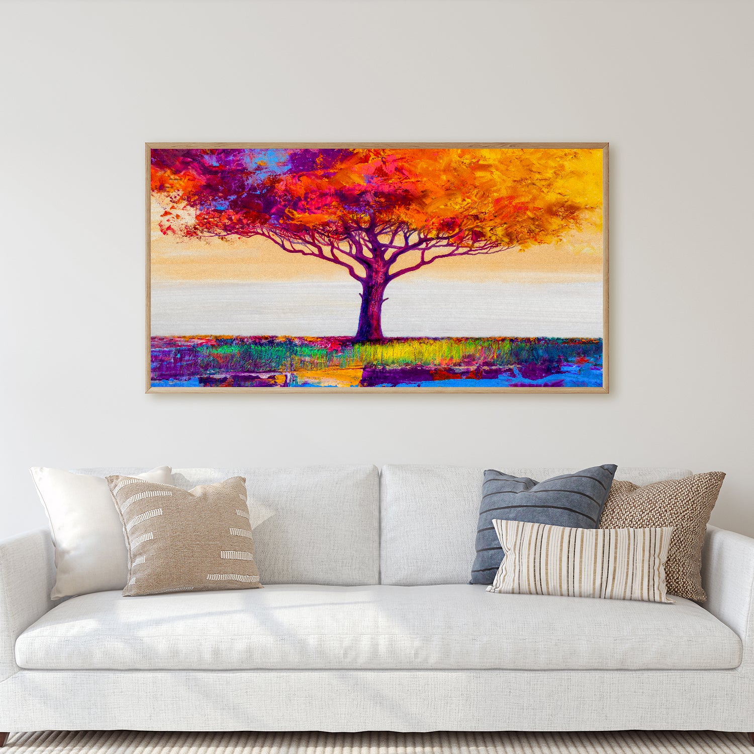 Colorful leaves burst from a tree in a vibrant field.