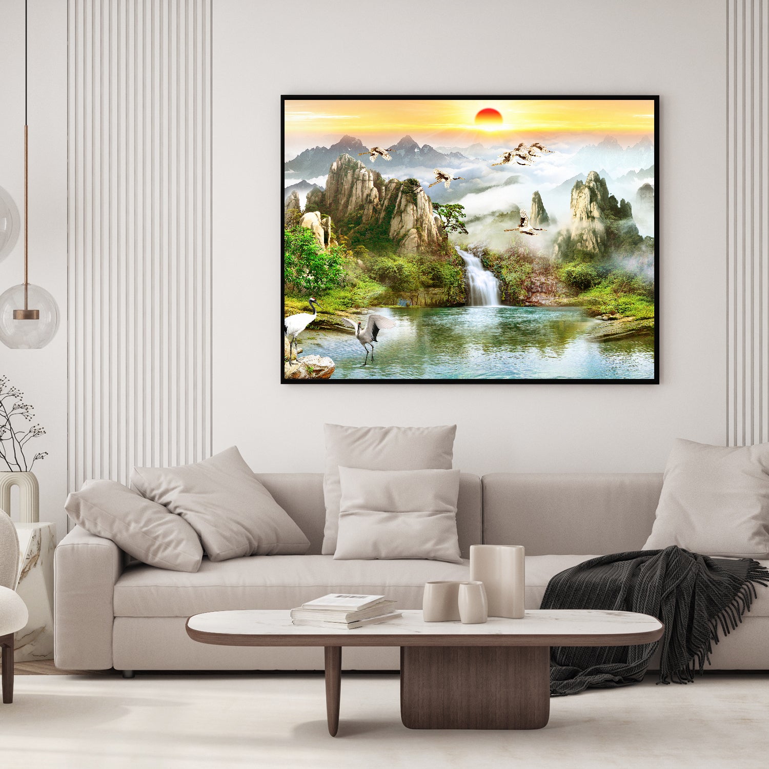 Mountain falls meet soaring cranes in a serene nature.